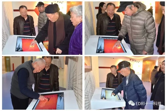 1496419643103588.jpg 老领导和大师纷纷在签名台前签名.webp.jpg